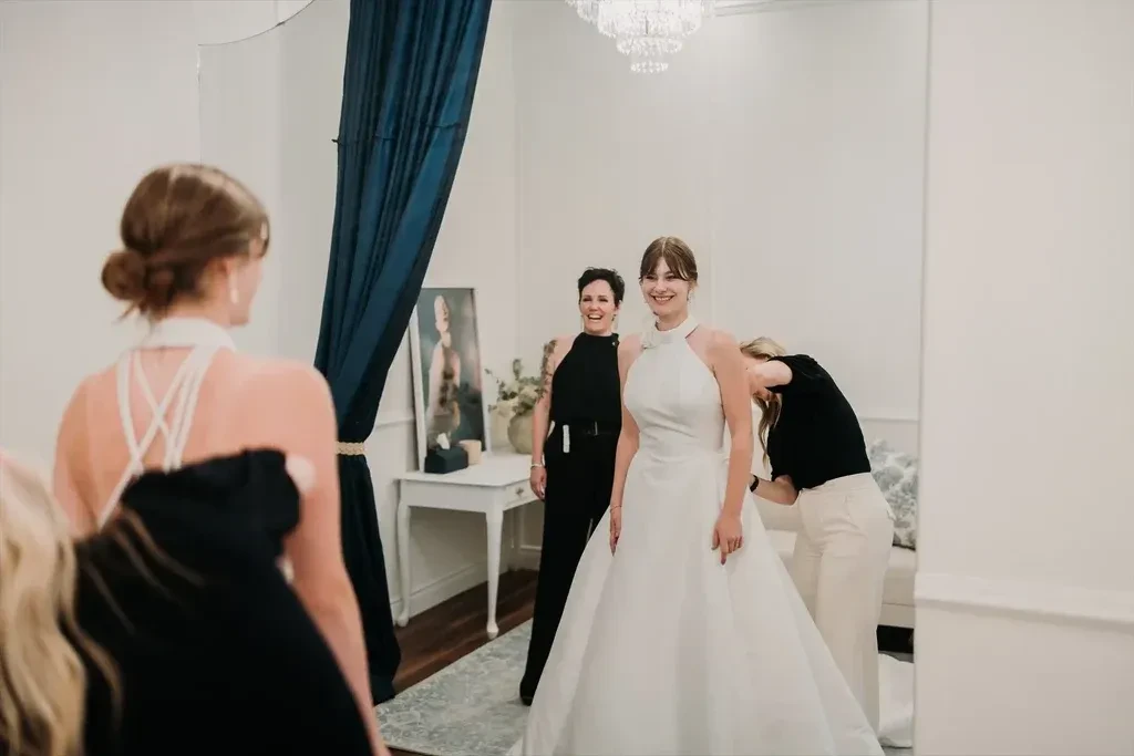 Bride trying on wedding dresses at Sinders Bridal House in Ottawa and Peterborough